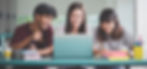Friends using laptop together