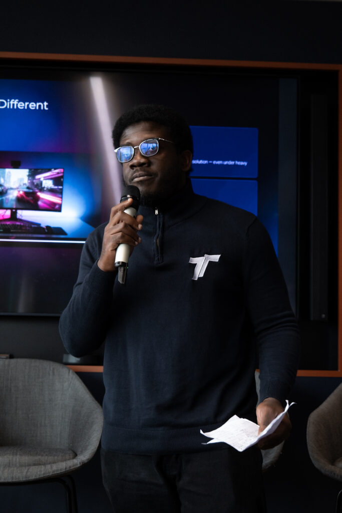 Oluwagbenga Obasa presenting the What's Actually Different slide about LoLa streaming performance, access control and security at RE:FORMAT Manchester.